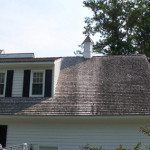 Roof Wash Before Exterior wooden roof covered with dirt and algae before cleaning